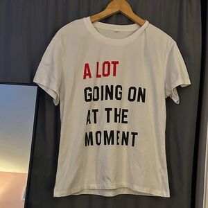 White Graphic T-Shirt with Bold Text. Taylor Swift themed.